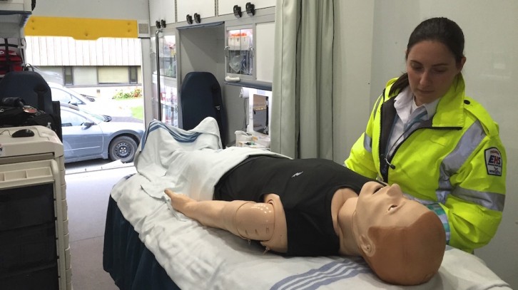 Janel Swain, clinical supervisor of the Mobile Simulation Unit, with a simulator.