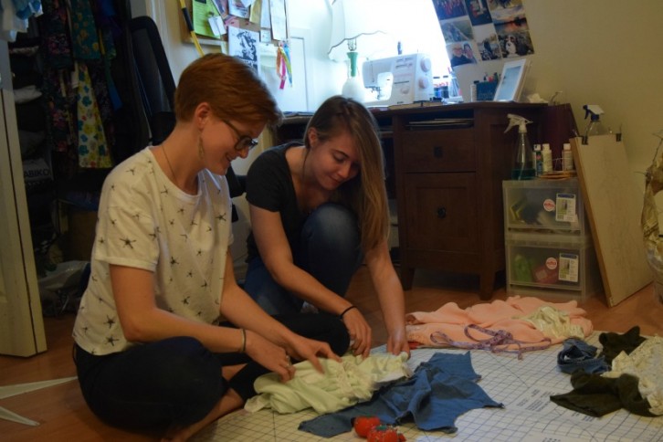 Donelle Fraser (left) and Emily Brown review materials in Fraser's home studio.