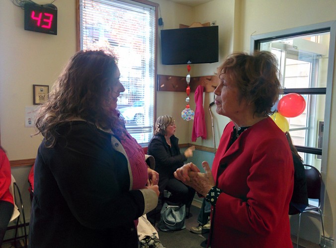 Margaret Casey (right) welcomes a patient to the North End Community Health Centre