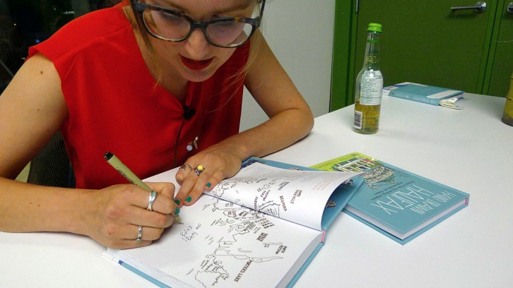 Fitzgerald signing copies of Hand Drawn Halifax at her book launch at the Halifax Central Library.