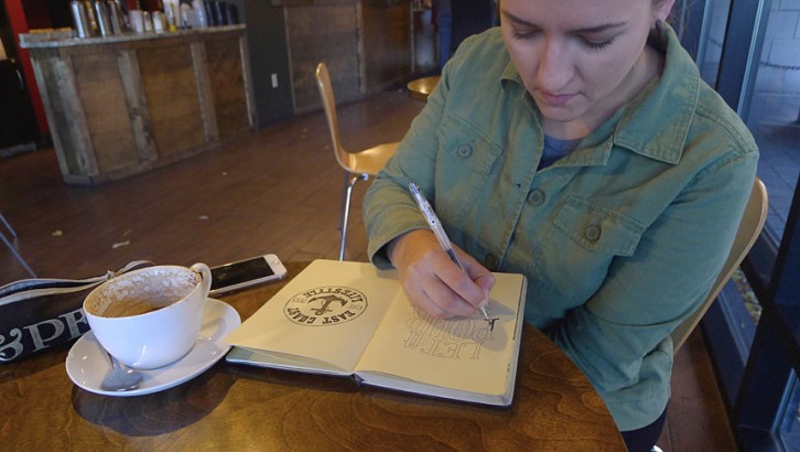 Stanton working on some lettering at the Smiling Goat on the Halifax waterfront.