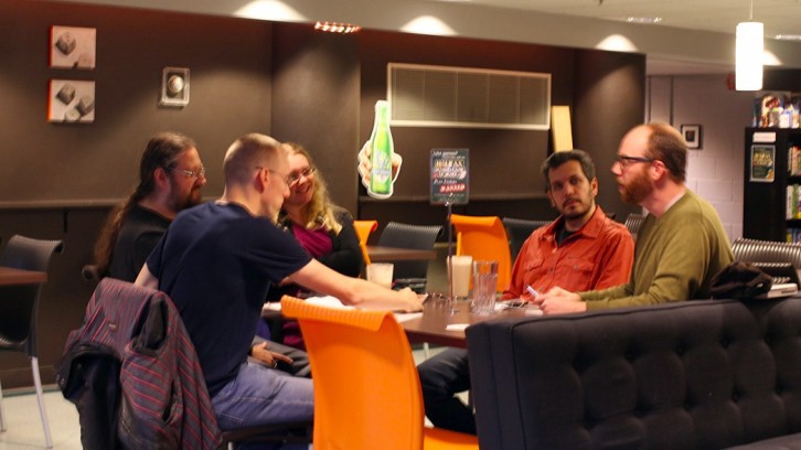 Fraser, far right, talking shop at the Board Game Designer’s Night.