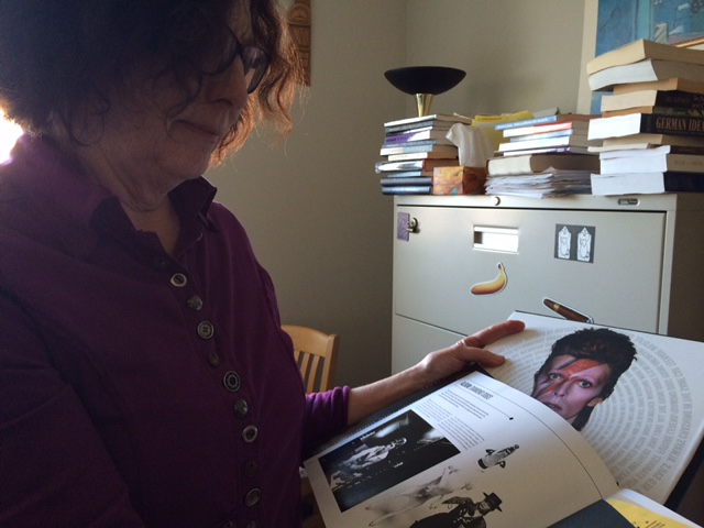 Professor Elizabeth Edwards looks fondly at a picture of David Bowie.
