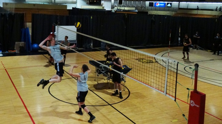 A player jumps to spike the ball