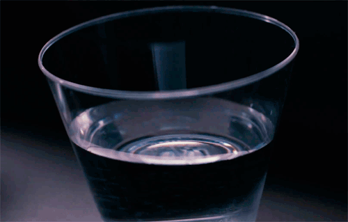 A glass of water shakes.