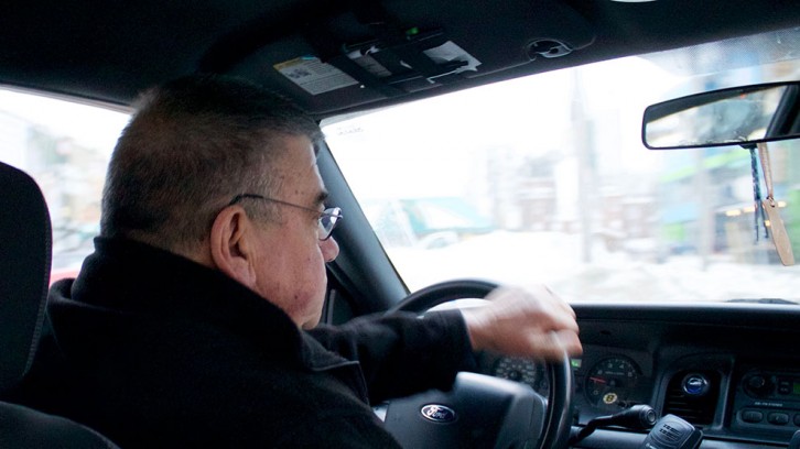 Charles O’Connell navigates rush hour traffic and snow banks in downtown Halifax.