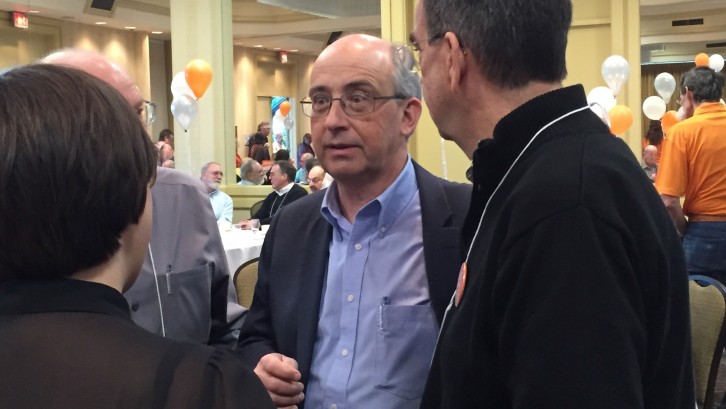 Gary Burrill, centre, strategizes minutes before it announced he will become the provincial party leader. 