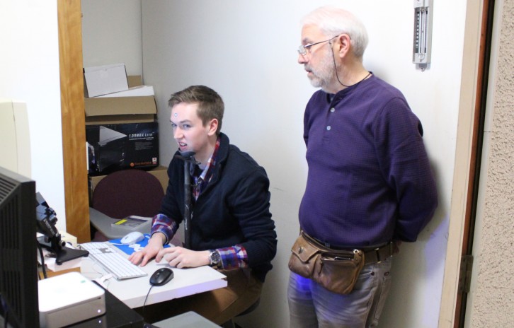 Klein and student Colin McCormick calibrate an eye-tracking system for an experiment.