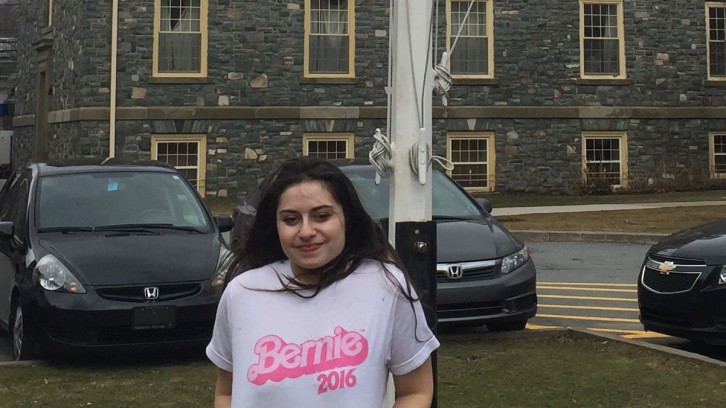 Olivia Canny shows off her shirt in support of Bernie Sanders