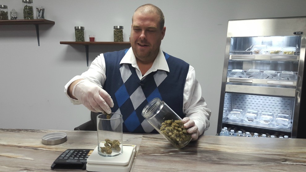 Mal Mcmeekin weighs marijuana the marijuana that will be sold to customers