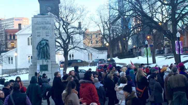 A large crowed gathered in Grand Parade Square, downtown Halifax, in solidarity on International Women's Day