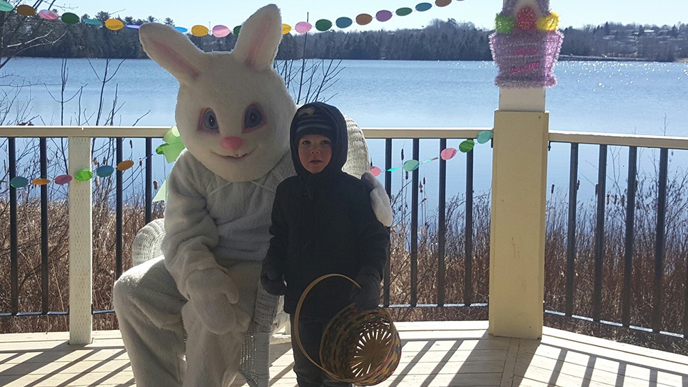 Adam, 3, poses with the Easter bunny.