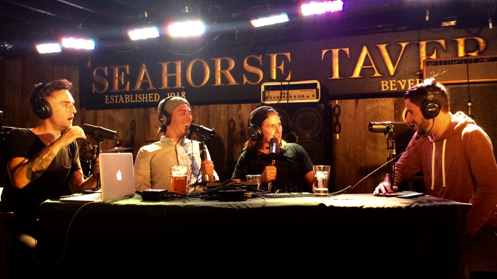From left, Saunders, MacGillivray, and Stever interview MacDonald (far right) on live podcast. 