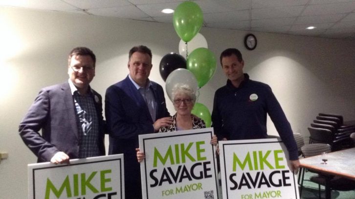 Newly re-elected Mayor Mike Savage celebrates with his campaign volunteers. 