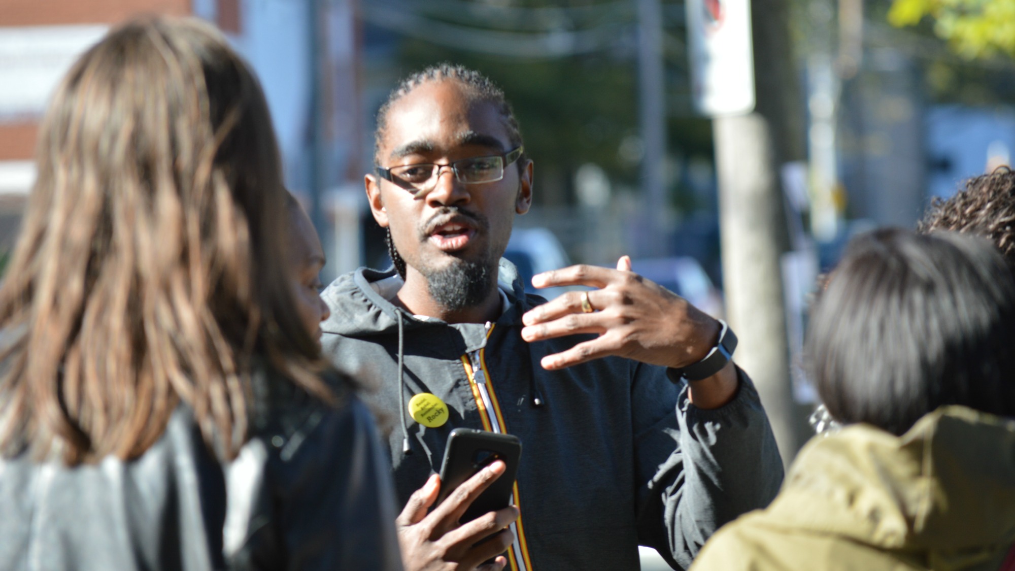 Lindell Smith instructs his supporters on how the march towards the polling station will work