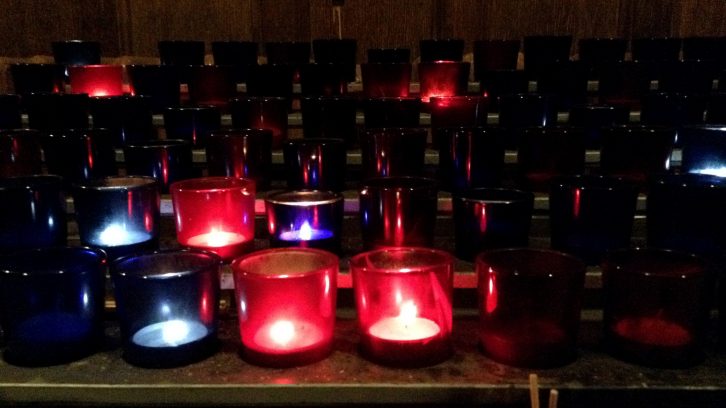 Prayer candles burn brightly in St. Mary's Cathedral Basilica. 