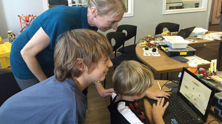 Kids learn to code robots during a class at Sylvan Learning Centre