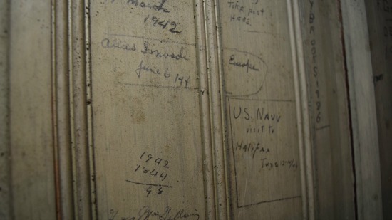 Parishioners marked events like the day the Allies invaded Normandy in 1944 on a door in the bell tower, now an off limits area due to damage 
