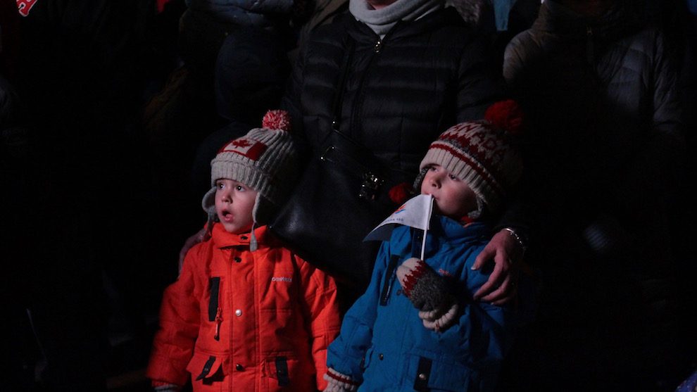 Maxwell and Gavin Prole stand with their grandmother mesmerized by the live performance by the Octonauts.