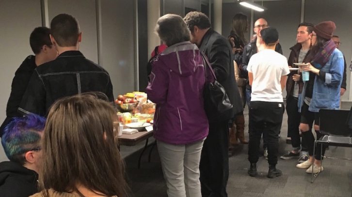 Attendees of the TDoR gather around for refreshments afterwards.