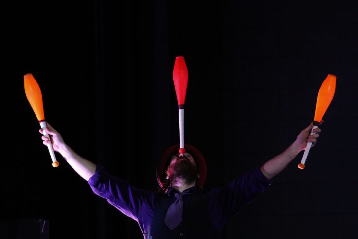Danger balances a club during the juggling routine.