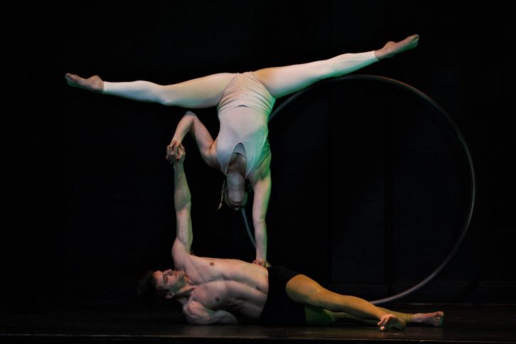 Alex Smith and his partner Cait perform and acrobatic act.
