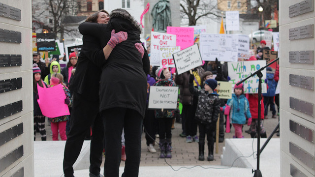 Trish Keeping and Liette Doucet share a hug at the rally.