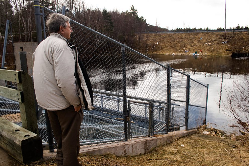 Bob Christie looks at the dam which replaced a bridge leading into the lagoon. 