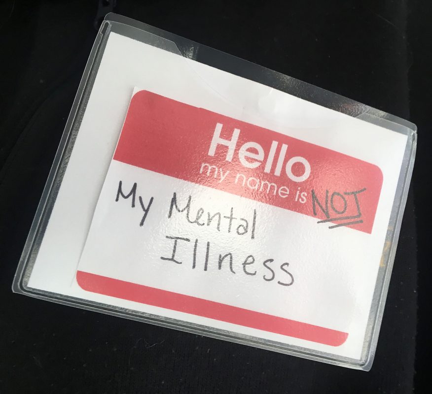 A name tag that says "Hello, I am not my mental illness".