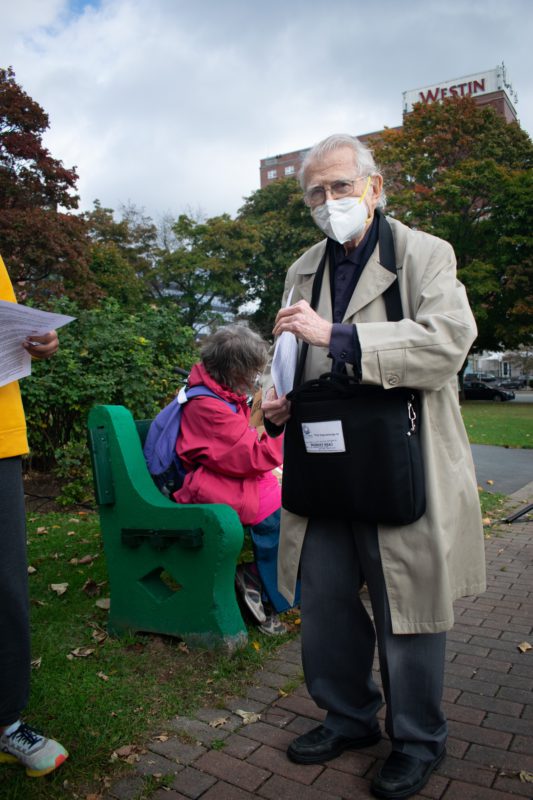 Robert M. Read, 94, intently handing out climate change 'to-do lists' at the Halifax climate strike.