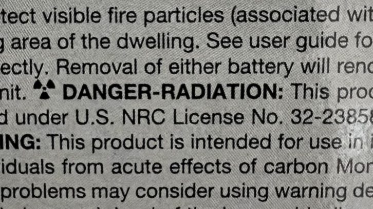 “DANGER-RADIATION” is a warning label printed on packaging for ionization smoke detectors.