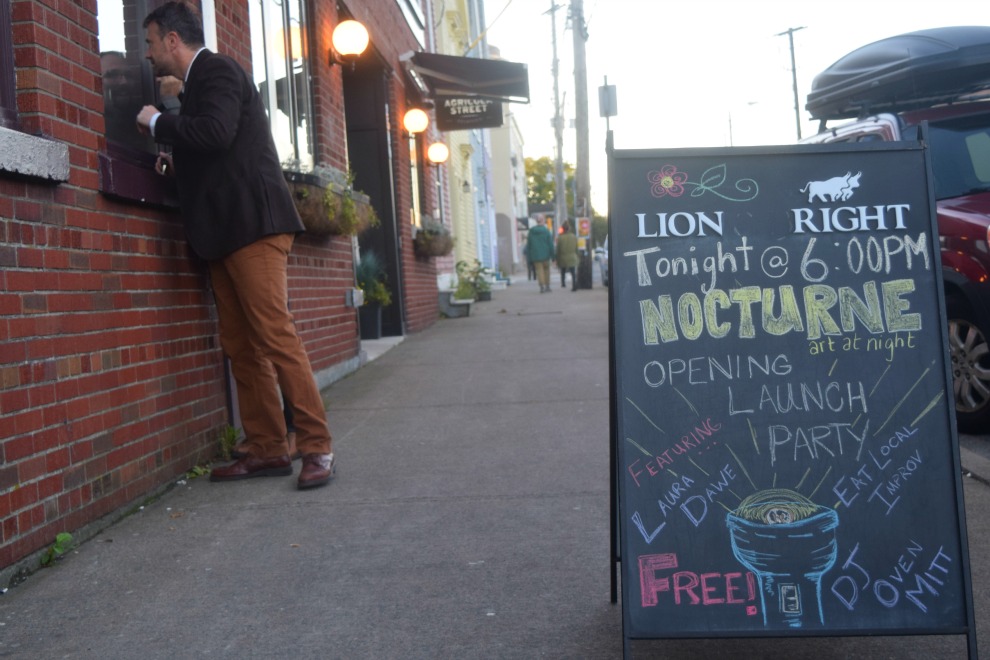An onlooker curious about Nocturne's opening night celebration at Lion & Bright on Agricola Street. (Photo: Emma Jones)