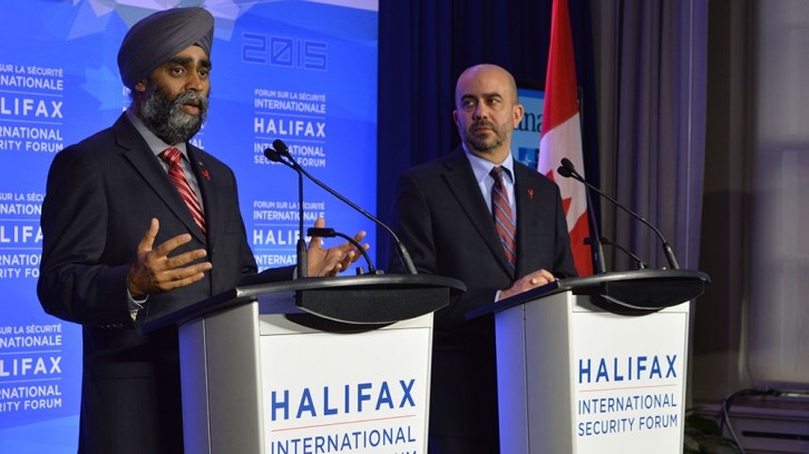 (Left to Right) Minister of National Defence Harjit Sajjan and Peter Van Praagh speaking at a press conference during the forum