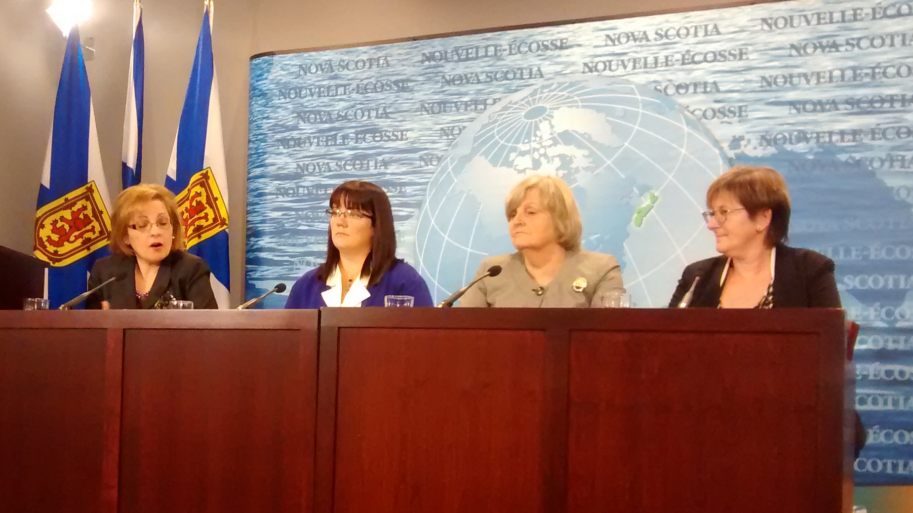 Lena Metlege Diab, Suzanne Ley, Gerry Mills and Barbara Miller Nix speak at a news conference.