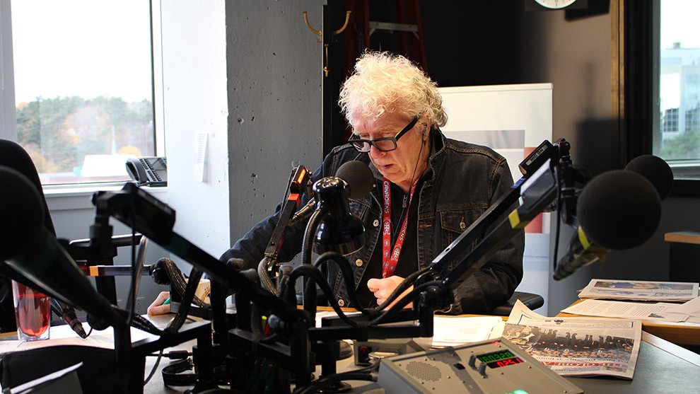 Sandy Smith looks on as Don Connolly enjoys his usual breakfast in the studio.