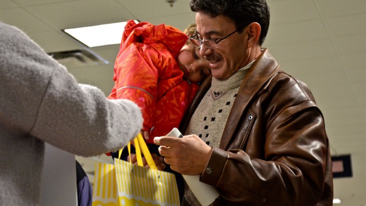 Family accepts gift bags.