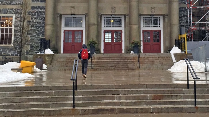 A student walks to Dalhousie in the rain