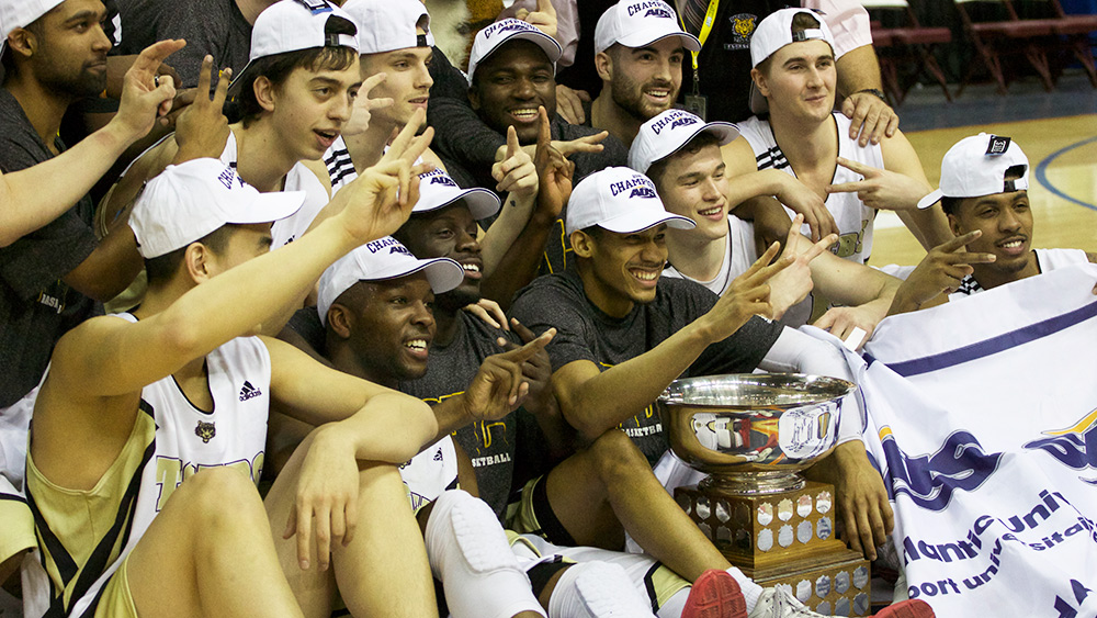 Dal Tigers pose with their trophy and banner.