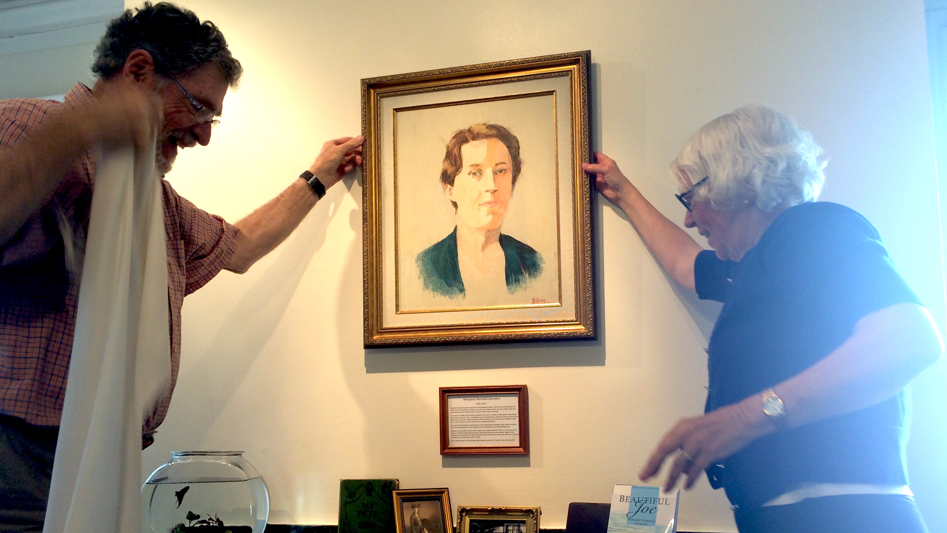 Moore (left) and Scott unveil painting of Margaret Marshall Saunders