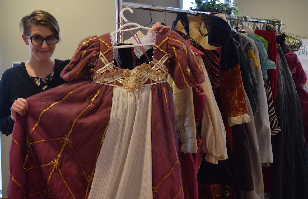 Colleen MacIsaac, artistic producer of the Villain’s Theatre, holds a costume up for sale, which was originally used for a production of The Duchess of Malfi. 