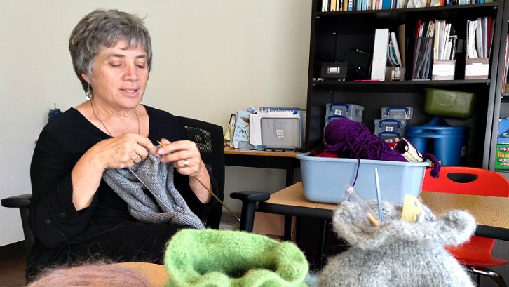 Linden Gray, founder of Caldy Grange knitting for the Philanthropic Knitters Guild - a project to end homelessness.