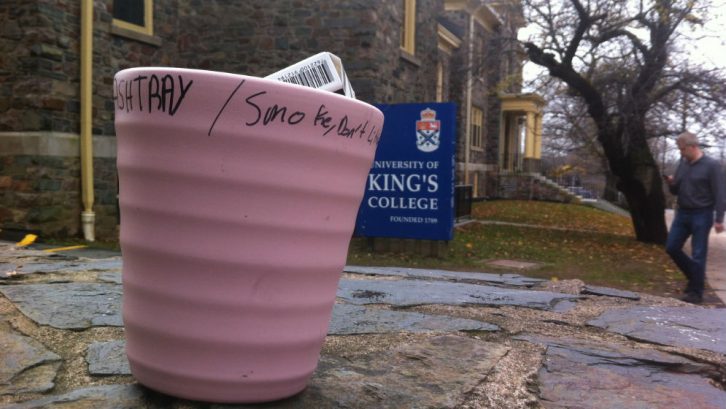 Banned from smoking on campus, smokers use this makeshift ashtray during cigarette breaks.