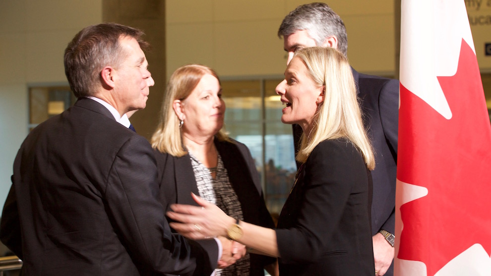 Federal Environment Minister Catherine McKenna shakes hands NSCC President, Don Bureaux. King's-Hants MP, Scott Brison and N.S. Environment Minister Margaret Miller also attended the news conference on Nov. 21. 