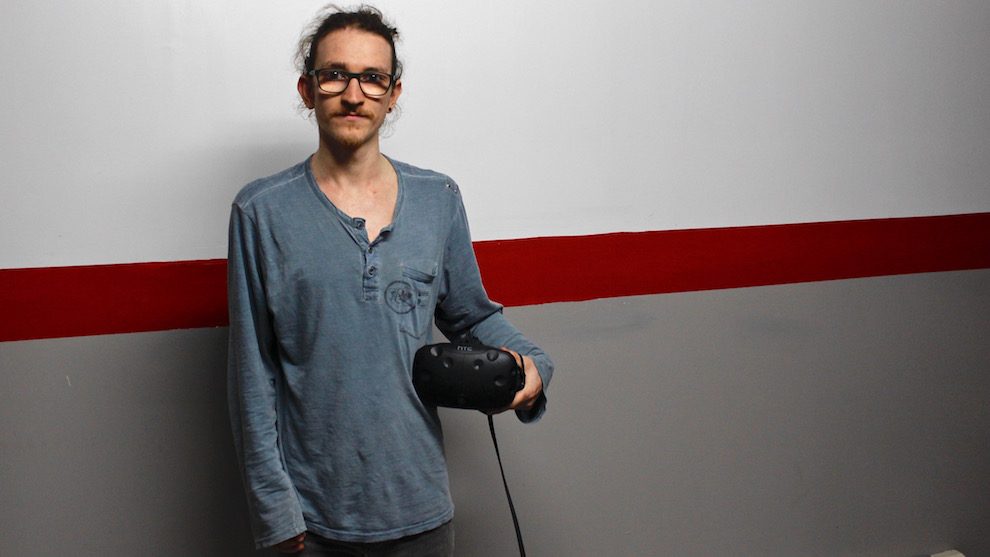 Keegan Francis holds his HTC vive headset, which is what you wear to enter VR.