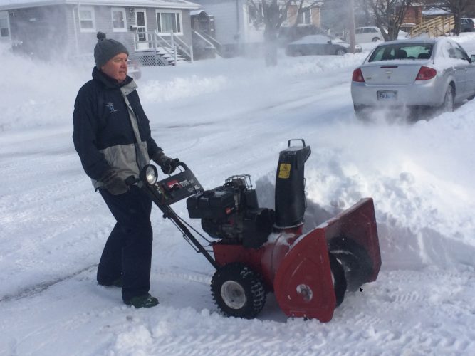 Wendell Coveyduc uses a snowblower to clear his driveway on Friday after the second snowstorm to Halifax in less than a week.