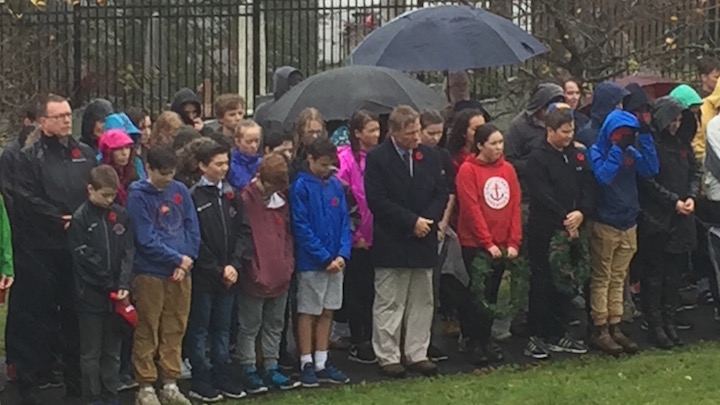 Students take a moment of silence to remember fallen soldiers. 
