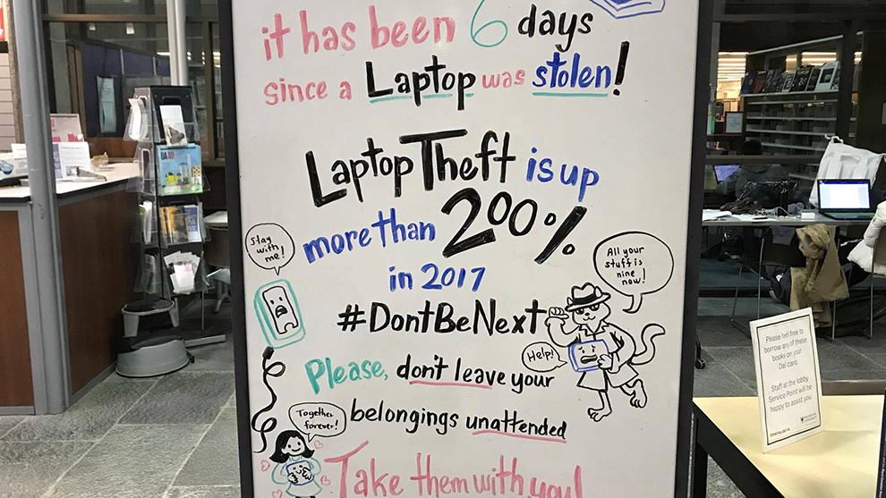 A sign warning students about laptop theft is located on the second floor of the Killam Memorial Library.