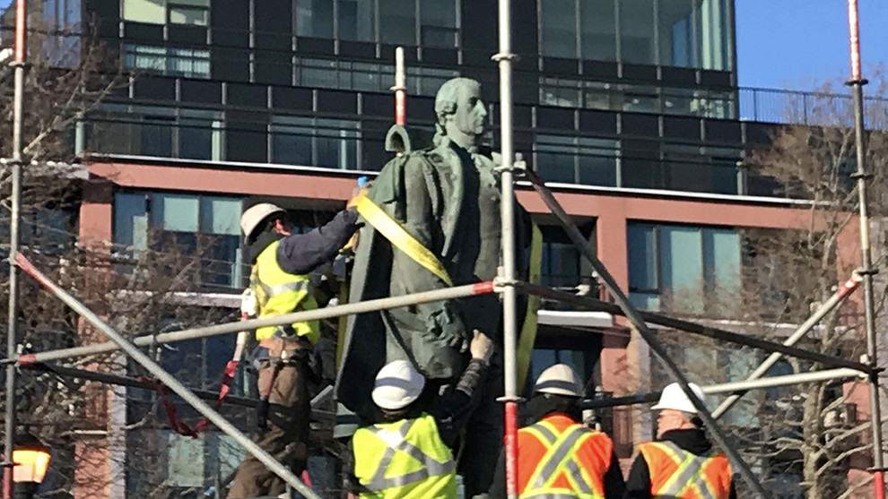 The statue is tied down.