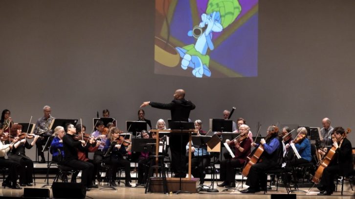 Daniel Bartholomew-Poyser conducts the Symphony Nova Scotia orchestra Wednesday as they play a snippet of their Looney Toons performance  for the launch of the 2018-19 season.