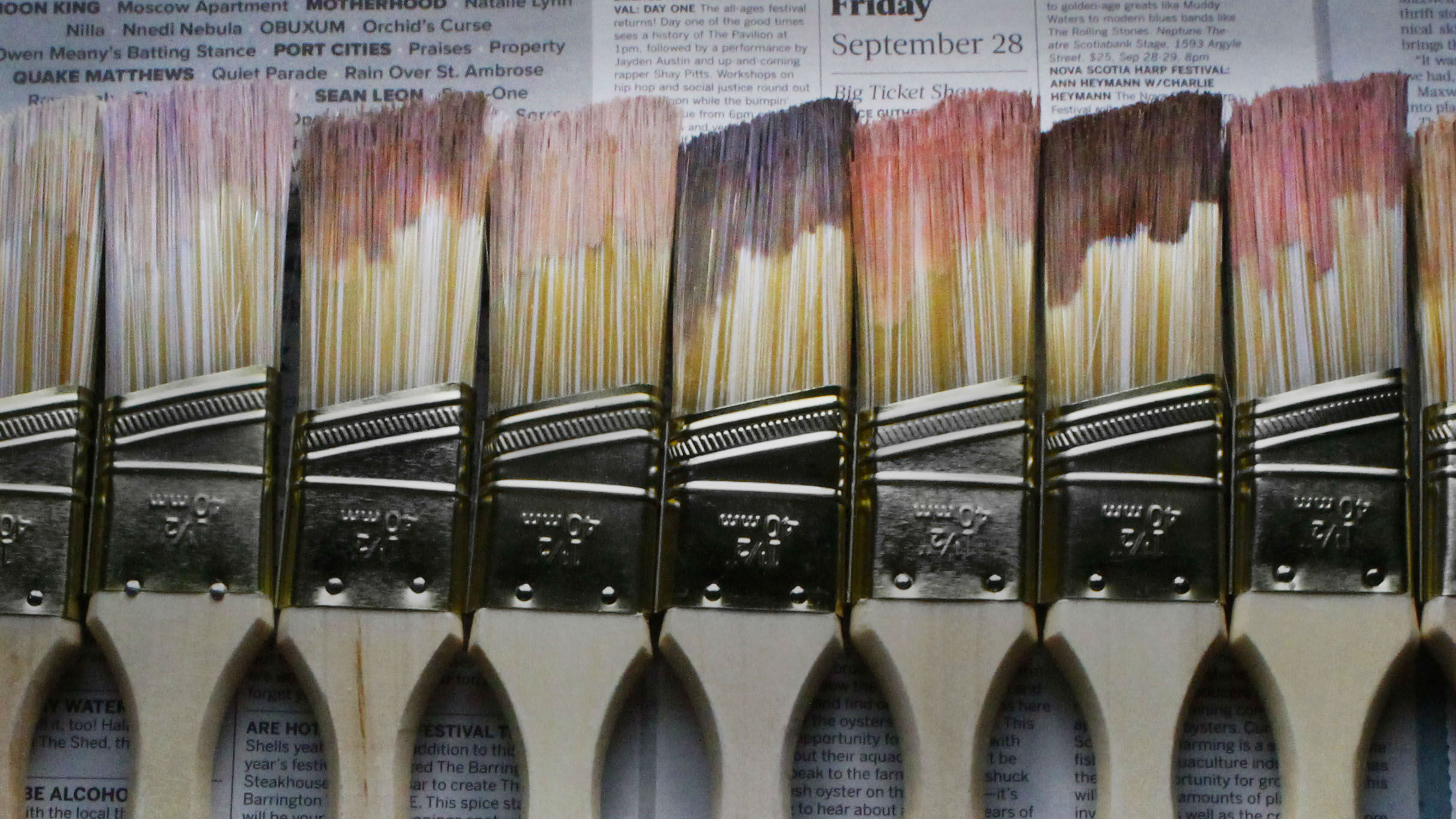 Paint brushes with different shades of paint.